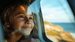 © AdPremium - Young Girl Smiling and Daydreaming by the Ocean Window
