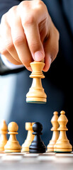 A hand strategically moves a chess piece during an intense game, highlighting focus and tactical skill in a professional setting.