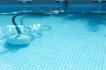 Poster - One robotic cleaner in swimming pool outdoors, space for text