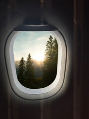 Wall Mural - Airplane taking off or landing, view on mountains from window