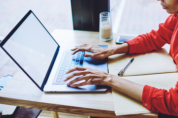 Fototapete - Serious afro american journalist planning schedule for interviews while searching calendar application on laptop device with copy space area for your internet advertising, concept of distance job