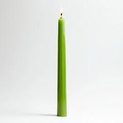 A green  wax candle displayed on an isolated background, highlighting its vibrant color and smooth texture