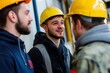 © Andrii - Workers discussing at a construction site