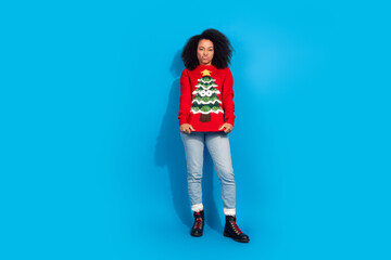 Canvas Print - Full length photo of lovely young lady show ugly sweater dressed red christmas garment celebrate winter holidays on blue color background