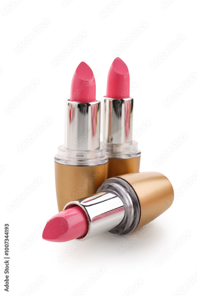 Beautiful pink lipsticks on white background