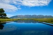 © Maxim Borbut - A luxury infinity pool with a sunny mountain view in a tranquil setting