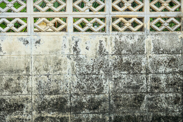 Wall Mural - A wall with a white border and a brown background. The wall is covered in dirt and has a faded look to it