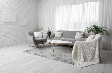 Wall Mural - Interior of modern room with comfortable armchairs and sofa