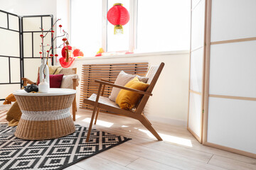 Wall Mural - Interior of living room with armchairs, table and decor for Chinese New Year celebration