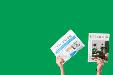 Sticker - Female hands with magazine and newspaper on green background