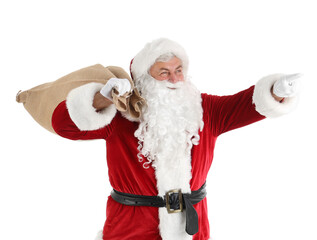 Canvas Print - Santa Claus with bag pointing at something on white background