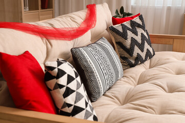 Canvas Print - Sofa with cushions in living room decorated for Japanese New Year celebration