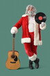 © Pixel-Shot - Santa Claus with vinyl disk for record player and guitar on green background