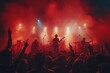 © Lexyat - A band performs on stage in front of a cheering crowd, bathed in red and blue stage lights.