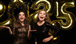 © ty - Happy gorgeous girls in stylish sexy party dresses holding gold 2025 balloons, having fun at New Year's Eve Party.