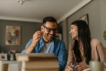 happy family couple managing household budget, planning investment, analyzing paper utility bills, m