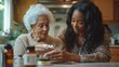 © MaMaKe - A young woman helps her elderly grandmother with her medication.