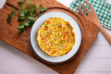 Wall Mural - Individual quiche with vegetables and crab surimi. Top view table with decoration.