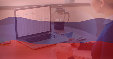Poster - Image of flag of russia over caucasian businesswoman using laptop