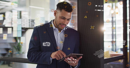 Poster - Image of financial data processing over biracial businessman using tablet in office