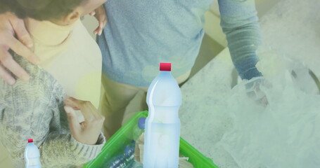 Poster - Image of ecology texts with recycling symbol over diverse couple sorting plastic bottles