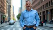 © Kromstar Studios - A middle-aged Caucasian man wearing a blue shirt and jeans, standing confidently on a city sidewalk with skyscrapers in the background