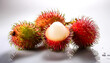 © Saddha Visual - Close-up of fresh Rambutan Fruit with water drops on a pitch solid white background