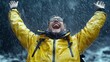 © Pual GotoMars - Person celebrating joyfully under heavy rain in a vibrant yellow jacket, isolated moment.