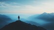 © Tin - A lone figure stands atop a mountain, overlooking a serene valley shrouded in mist, embodying solitude and nature's beauty.