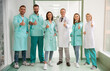 © My Ocean studio - Cheerful group of healthcare professionals in lab coats and scrubs standing in hospital hallway giving thumbs up, symbolizing success, positivity, and quality care. Medical and teamwork themes.