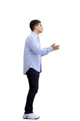 Wall Mural - A man, full-length, on a white background, spreads his arms