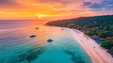 Wall Mural - A colorful sunset over Koh Larn, casting a golden glow over the beach and turquoise waters.