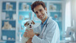 © sabyna75 - Veterinarian holding a happy puppy in a bright clinic