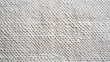 © tonstock - Close-up of textured beige fabric, showcasing intricate woven patterns and natural fibers, ideal for home decor, fashion, and textile design projects.