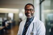 © NikoG - Portrait of a middle aged African American male doctor in hospital office