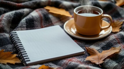 Poster - Image of a notebook, a blank white notebook, placed on a blanket with a cup of coffee next to it, representing writing, narrating stories, writing work, peace and relaxation.