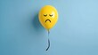 © Adam - Yellow balloon with a sad face isolated on a blue backgroun. Emotive illustration of sadness, perfect for expressing negative emotions or moods.
