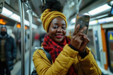 Wall Mural - A person captures her moment on public transportation, possibly for social media sharing