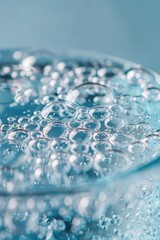 Aufkleber - A clear glass filled with water and air pockets