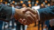 © Anna - Business handshake at a networking event with blurred background. Partnership and professional agreements.