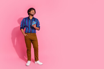 Poster - Photo of cheerful nice elegant man wear trendy striped clothes look empty space banner isolated on pink color background