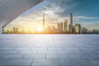 Empty square floor and city skyline with modern buildings scenery in Shanghai at sunrise. car advertising background.