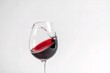 © Ioan - The one wine glass with red wine against white background
