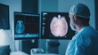 © Dara - Urologist showing a patient images of the bladder during a consultation for bladder cancer.