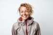 © Markus Schröder - Portrait of a happy woman in her 40s wearing a lightweight packable anorak isolated in white background