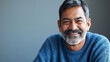 © Robert Kneschke - Portrait of a cheerful Indian man in his 60s with a joyful smile