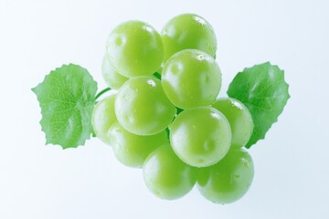 Poster - Fresh green grapes with leaves on a white background, perfect for food or nature photography