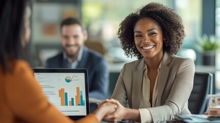 Poster - A woman in a business suit shakes hands with a man in a suit