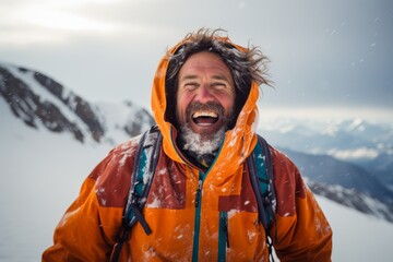 Canvas Print - Portrait of a joyful man in his 40s wearing a windproof softshell over snowy mountain range