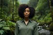© Markus Schröder - Portrait of a glad afro-american woman in her 30s wearing a classic turtleneck sweater over lush tropical rainforest